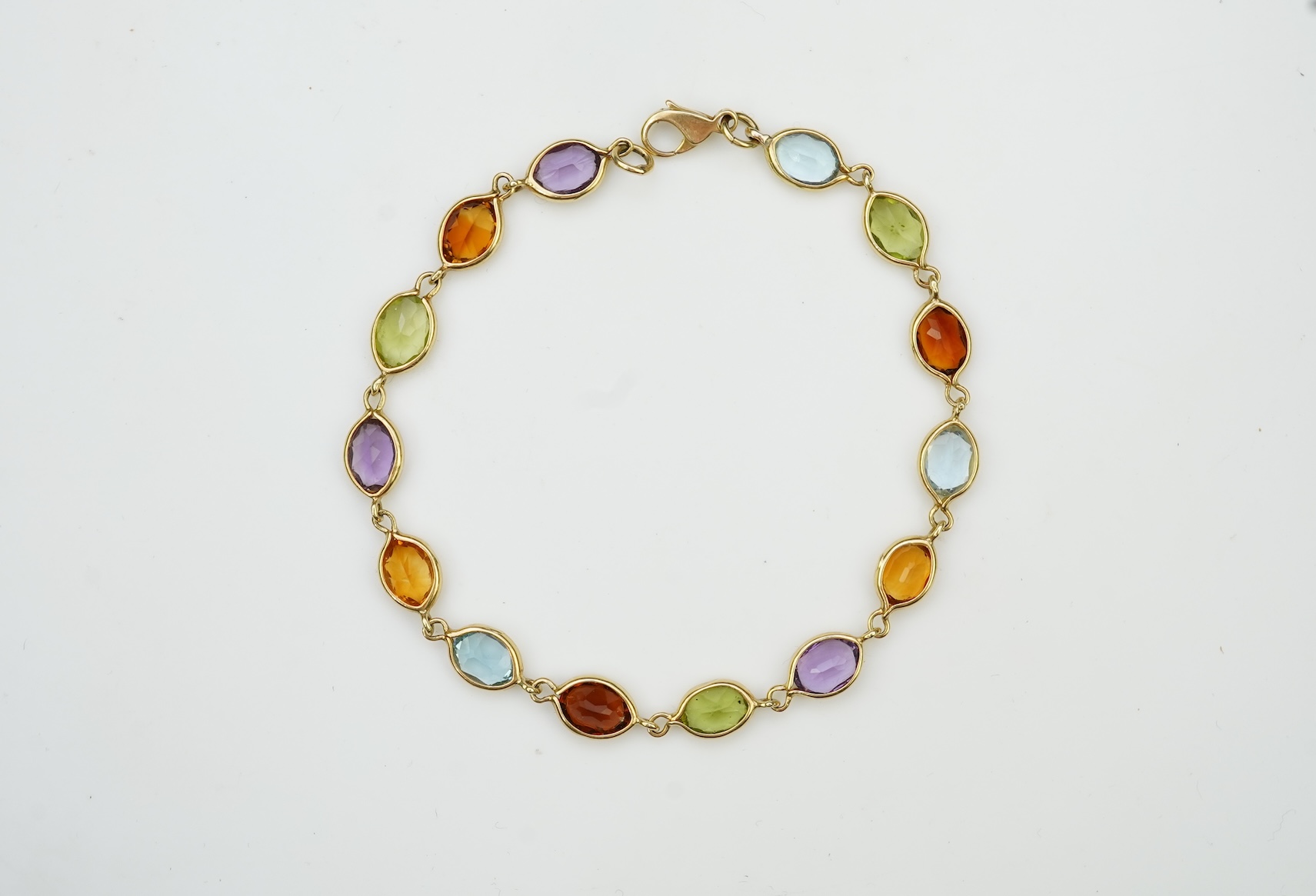 A gold and gem-set bracelet